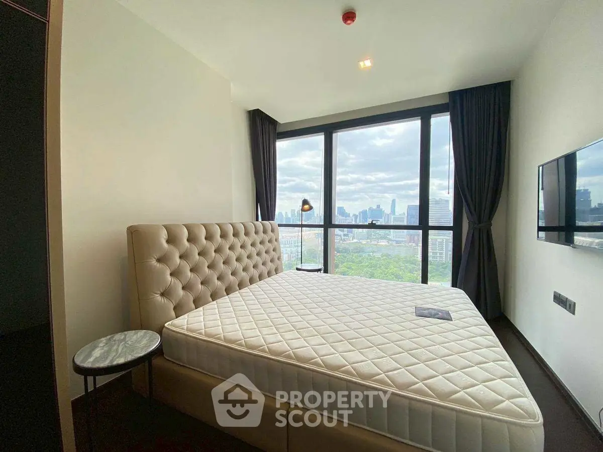 Luxurious bedroom with panoramic city view and elegant decor