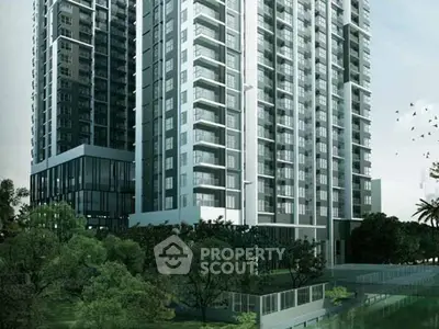 Modern high-rise residential building with lush green surroundings and sleek architectural design.