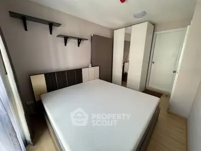 Modern bedroom with minimalist design and ample storage space