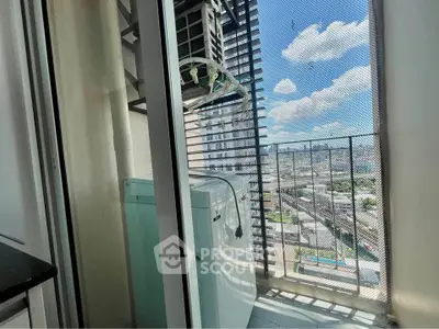 Modern apartment balcony with city view and washing machine setup.