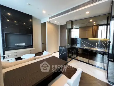 Luxurious modern living room with open kitchen and sleek black marble accents