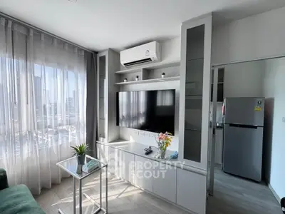 Modern living room with sleek TV unit and air conditioning, featuring large windows and stylish decor.