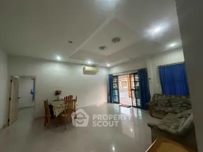 Spacious living room with dining area and modern decor