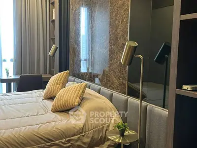 Luxurious bedroom with modern decor and elegant lighting, perfect for relaxation and comfort.