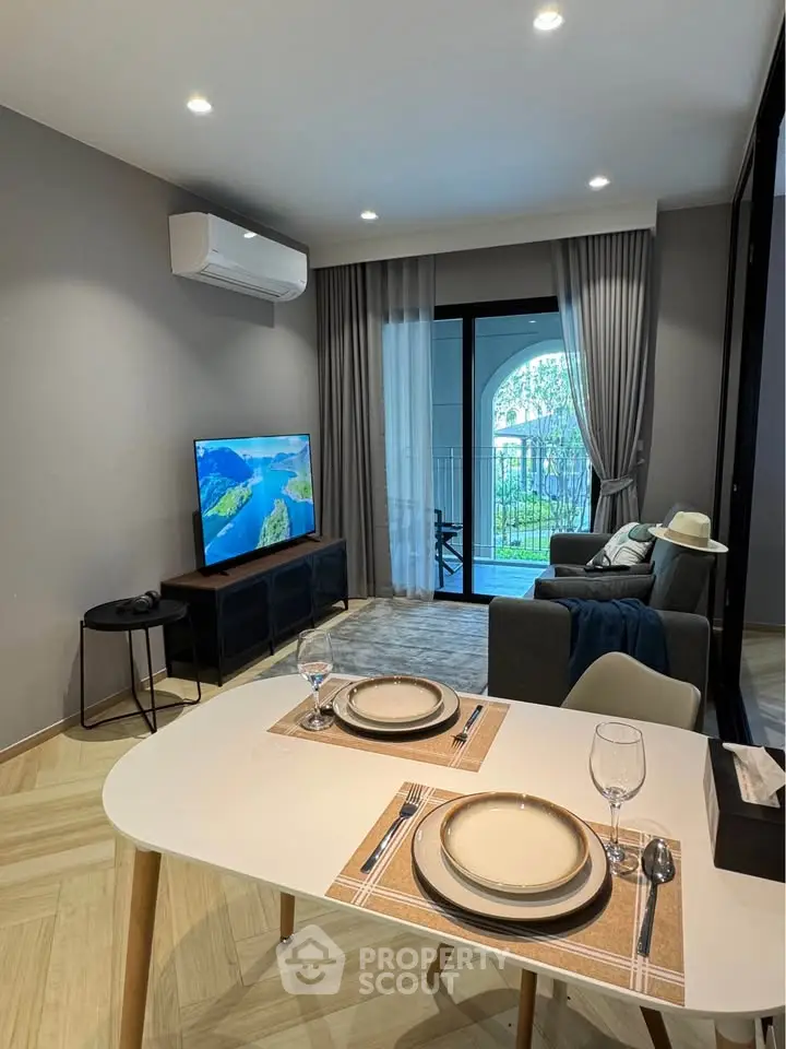 Modern living room with stylish decor and balcony view