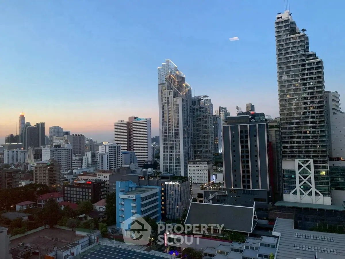 Stunning city skyline view with modern high-rise buildings at sunset, perfect for urban living enthusiasts.