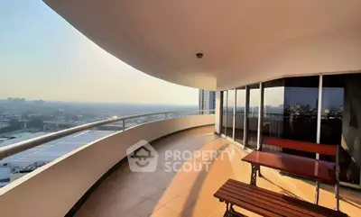 Spacious balcony with stunning cityscape view and modern design.
