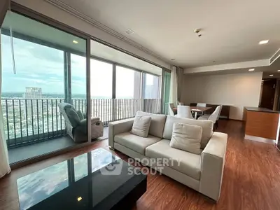Spacious modern living room with large balcony and stunning city view