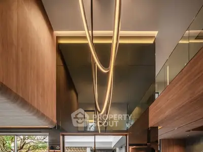 Luxurious modern interior with stunning architectural lighting and wooden accents.