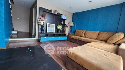 Spacious living room with modern decor and comfortable seating