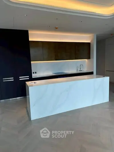 Modern kitchen with sleek island and ambient lighting in luxury apartment