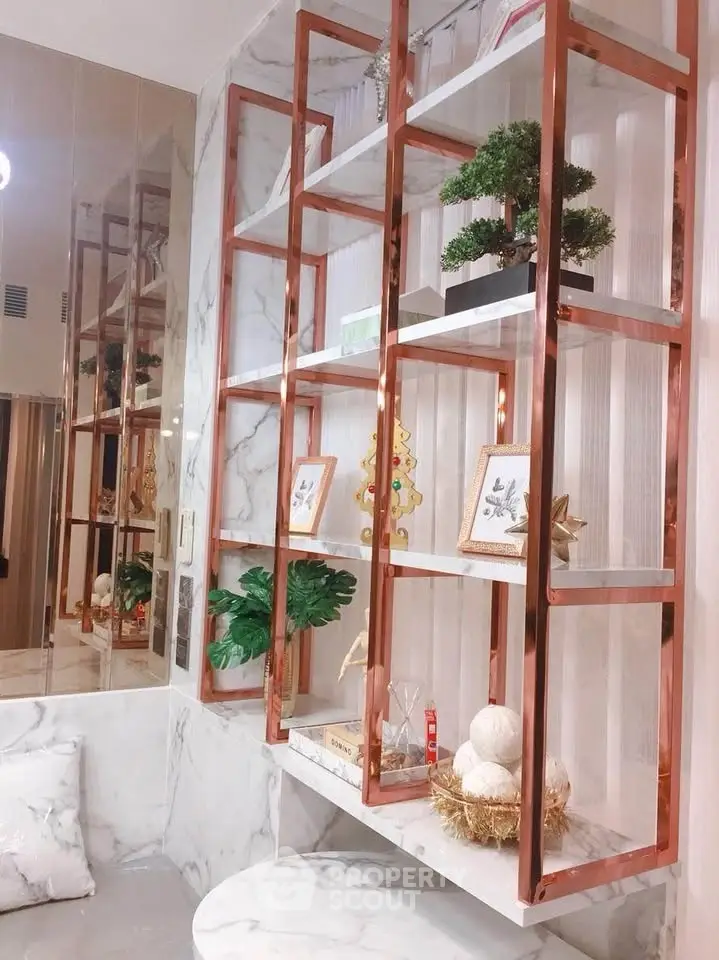 Elegant interior with marble and copper shelving showcasing modern decor accents.