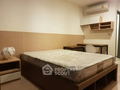 Modern bedroom with stylish furniture and air conditioning, perfect for comfort and relaxation.