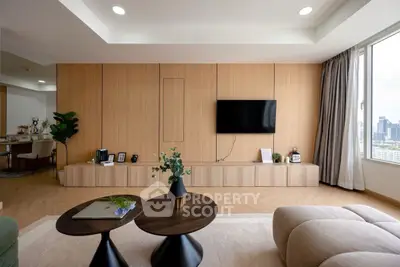 Modern living room with wooden paneling and city view, featuring stylish decor and natural light.