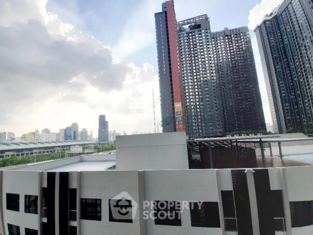 Stunning cityscape view from high-rise apartment balcony