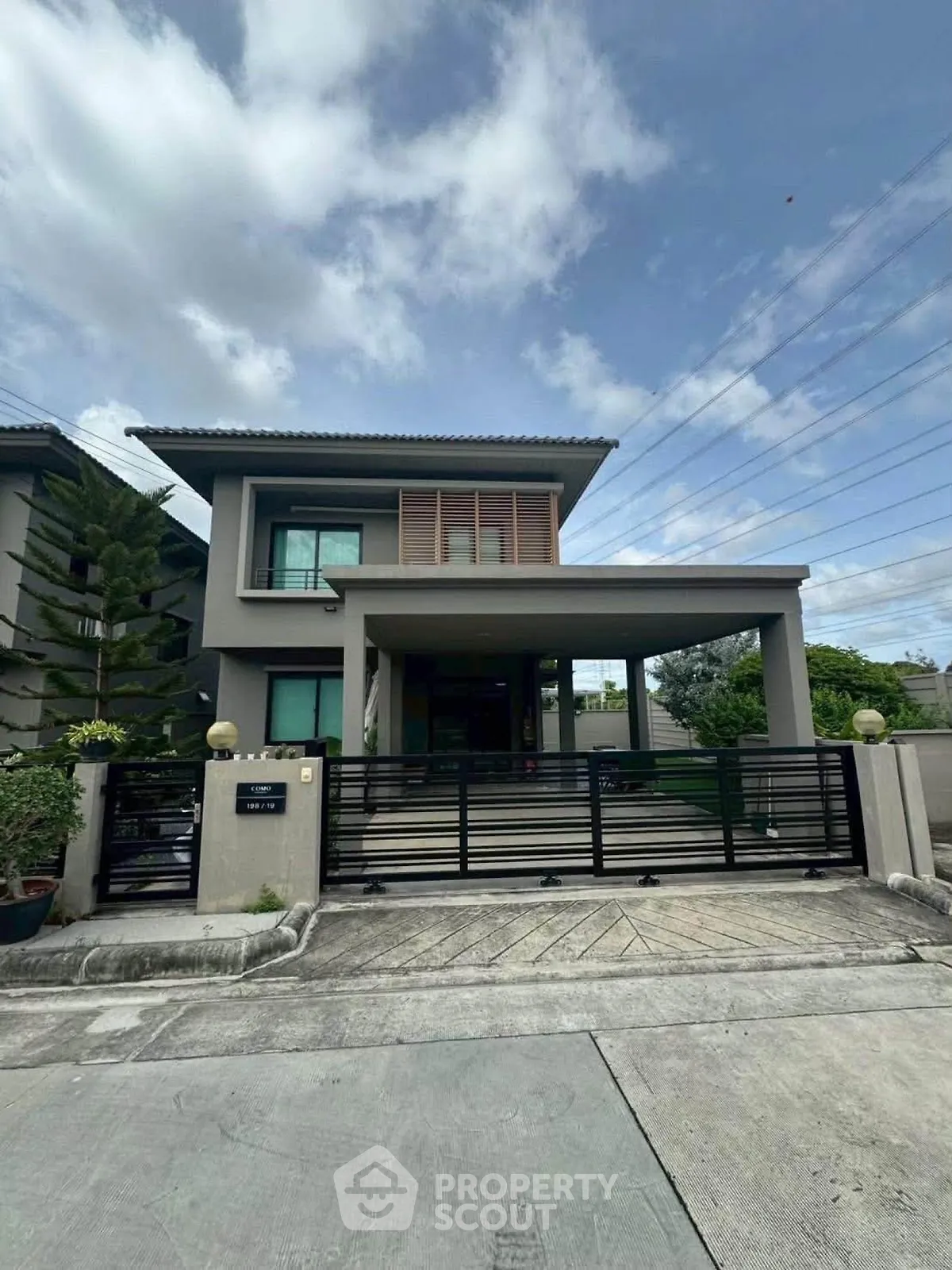 Modern two-story house with sleek design and spacious driveway