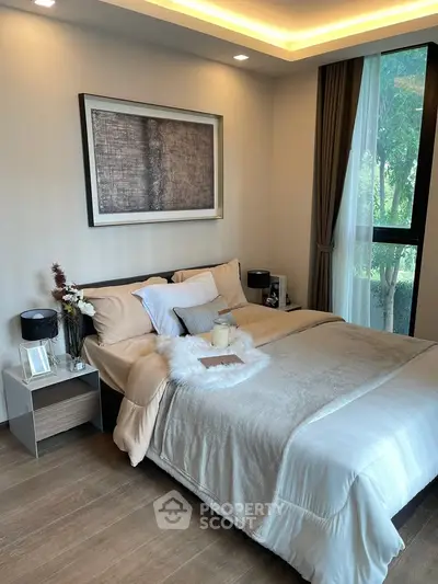 Luxurious bedroom with elegant decor and large window view