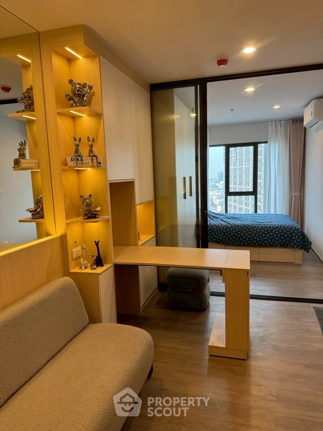Modern apartment interior with cozy living area and stylish bedroom view