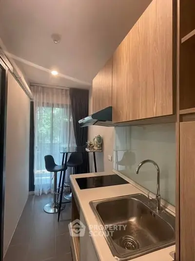 Modern kitchen with sleek design and cozy dining area