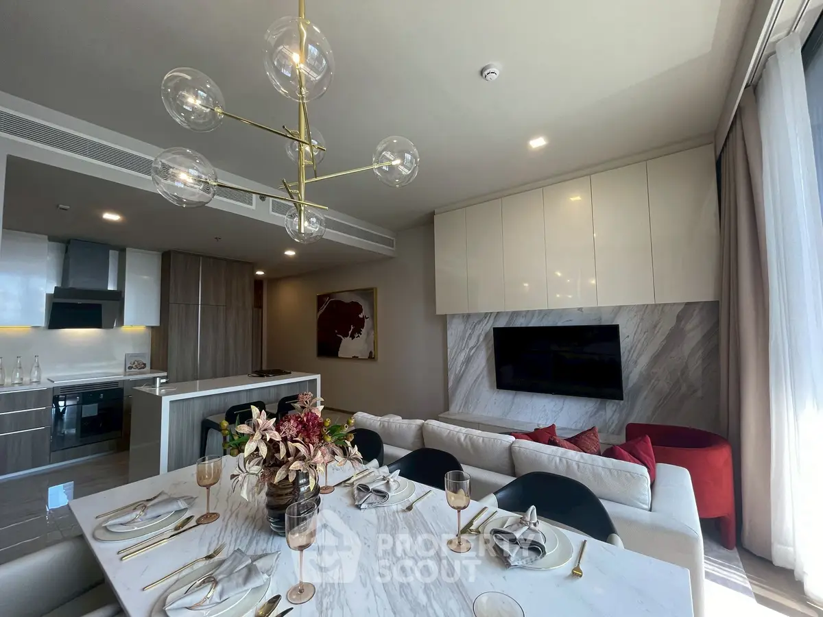 Luxurious modern living room with elegant dining area and open kitchen layout.