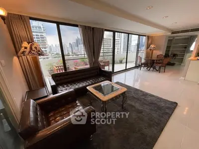 Spacious living room with city view and large balcony in modern apartment