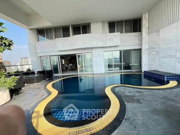 Luxurious rooftop pool with modern design and city views, perfect for relaxation and entertainment.