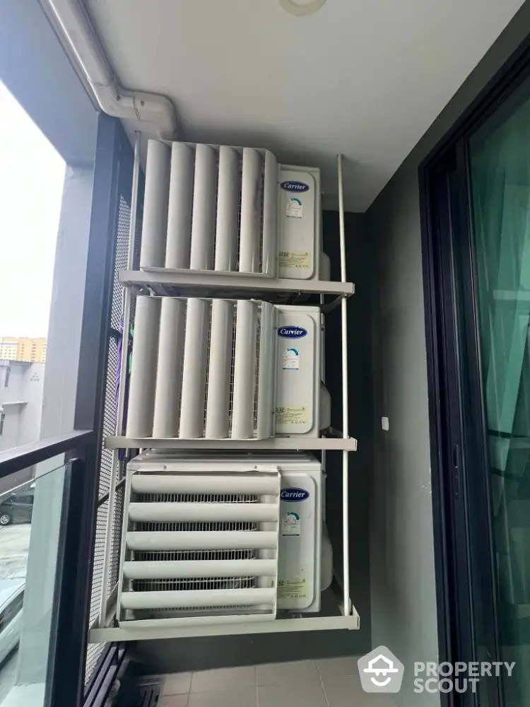 Modern apartment balcony with air conditioning units installed for efficient cooling.