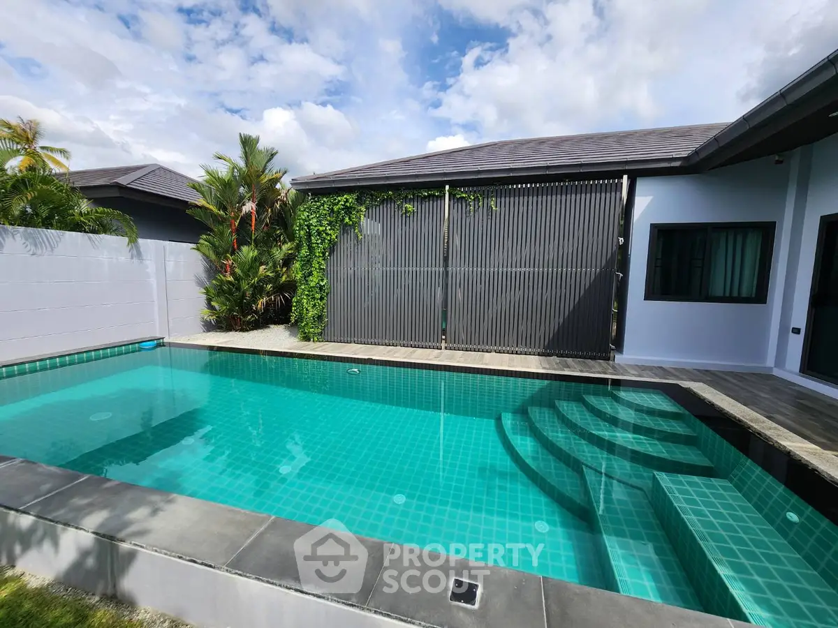 Stunning modern home with private pool and lush greenery, perfect for relaxation and entertainment.