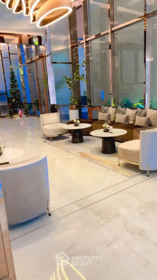 Luxurious modern lobby with elegant seating and festive decor