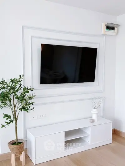 Modern living room with wall-mounted TV and stylish decor