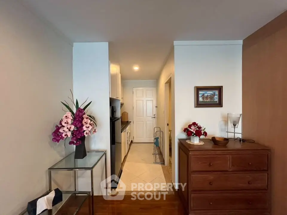 Charming interior hallway with elegant decor and modern appliances, perfect for cozy living.