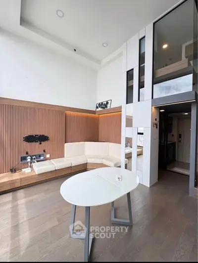 Modern living room with high ceiling and stylish decor