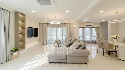 Spacious modern living room with elegant decor and open layout, perfect for family gatherings.