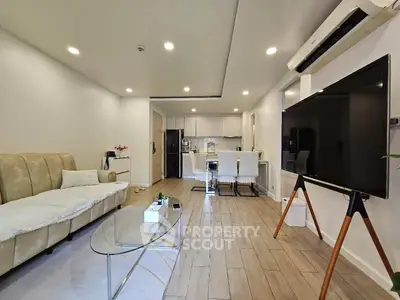 Spacious modern living room with open kitchen and stylish decor