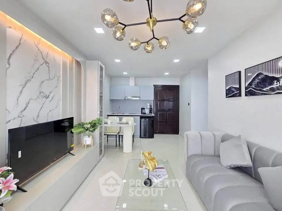 Modern living room with elegant decor and open kitchen layout