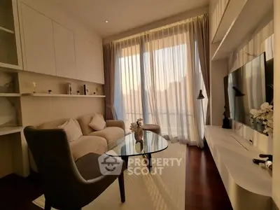 Elegant living room with modern decor and large window view