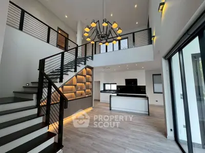 Stunning modern living room with high ceilings and elegant staircase in luxury home