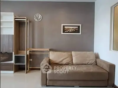 Modern living room with stylish sofa and wall decor