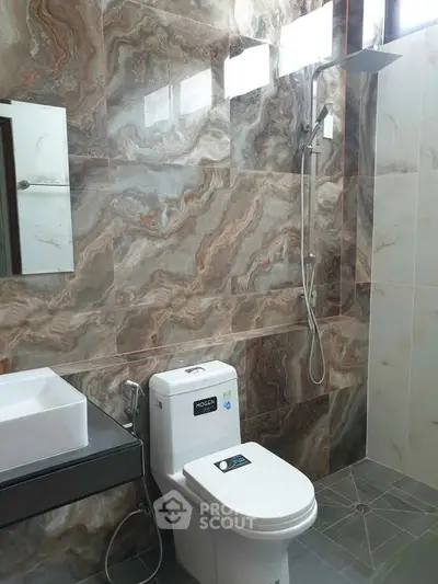 Luxurious modern bathroom with elegant marble tiles and sleek fixtures