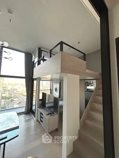 Modern loft apartment with mezzanine, large windows, and stylish interior design
