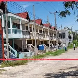 Charming row of colorful townhouses with unique architectural design and spacious balconies.