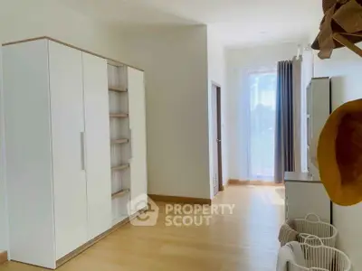 Bright bedroom with modern wardrobe and natural light