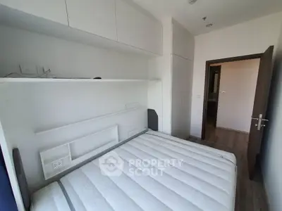 Modern bedroom with built-in storage and sleek design