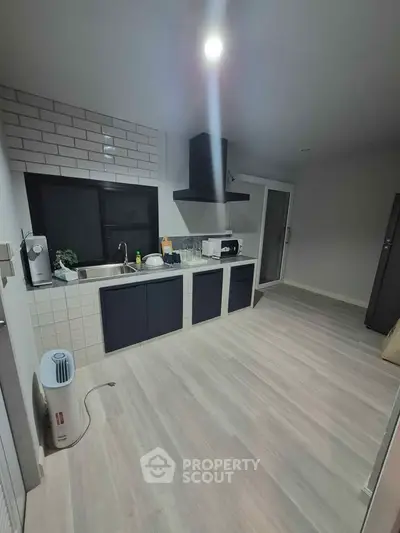 Modern kitchen with sleek cabinetry and open layout