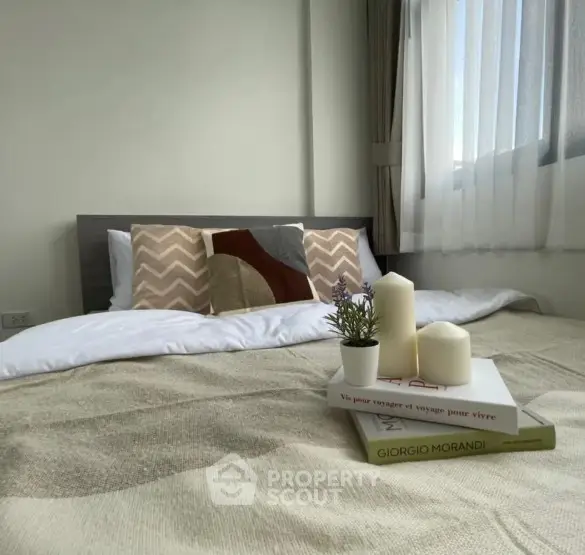 Cozy bedroom with stylish decor and natural light