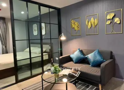 Modern living room with glass partition and stylish decor
