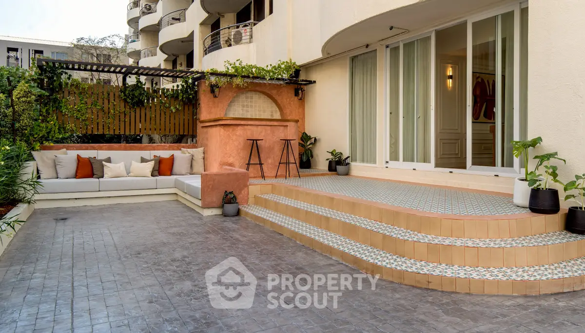 Stylish outdoor patio with seating area and modern design elements.