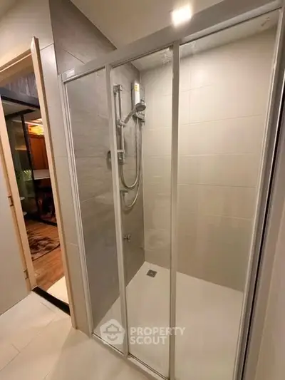 Modern bathroom with glass shower enclosure and sleek design