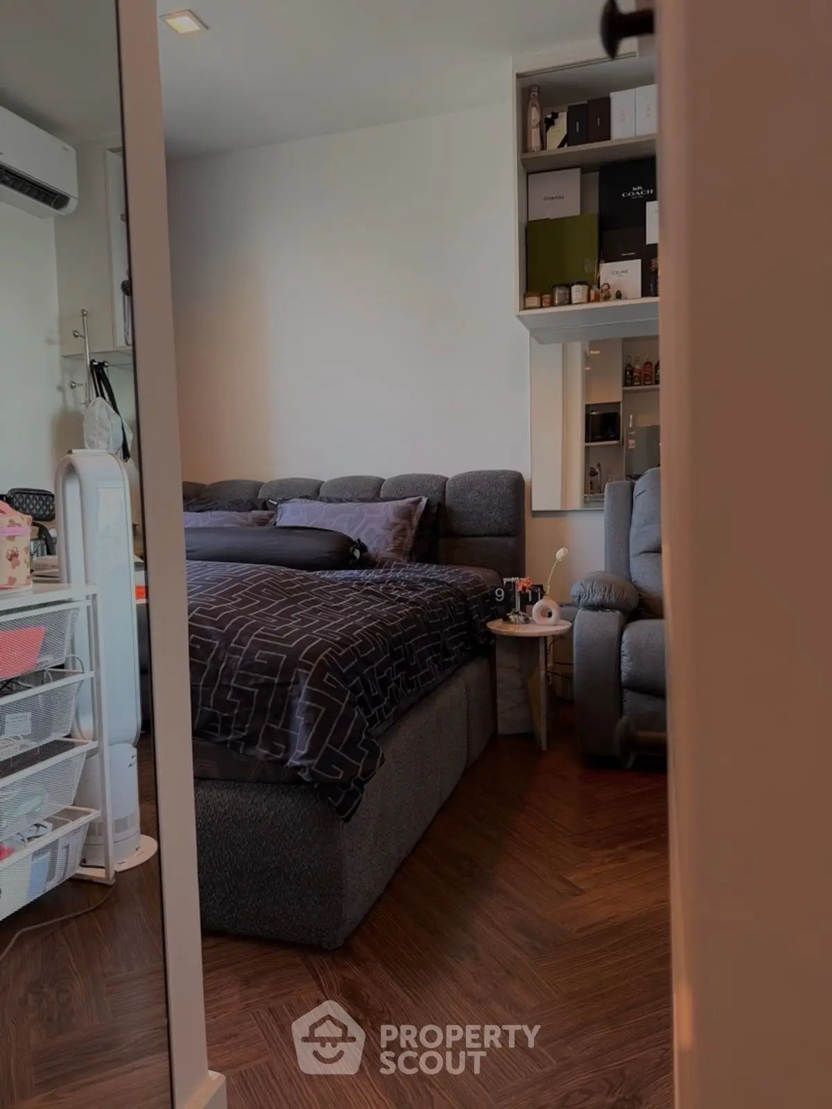 Cozy bedroom with modern decor and ample storage space.