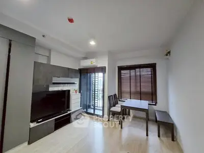 Modern living room with sleek design and balcony access